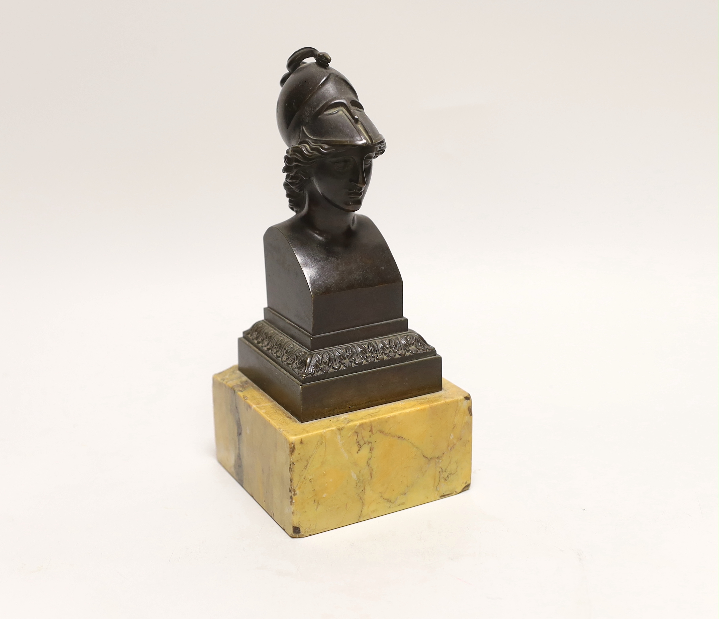 After the Antique, a bronze bust of Athena, on a Sienna marble plinth, approximately 23cm high